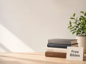A stack of Bibles on a table, ready for free distribution.